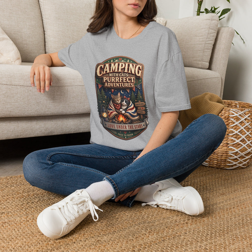Camping With Cats Purrfect Adventures t-shirt in Sport Grey, worn by a woman seated on a rug