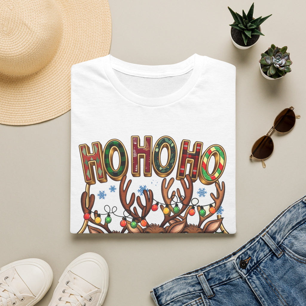 Reindeer Trio Ho Ho Ho Christmas Lights print on a White t-shirt, folded beside a straw hat and jeans
