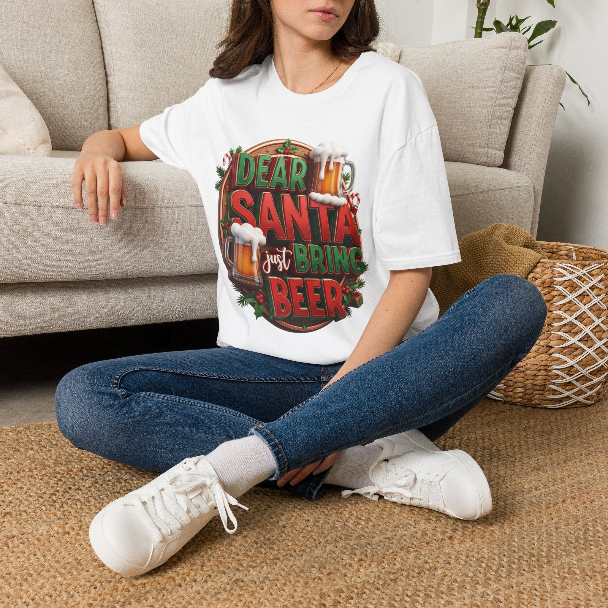 Dear Santa Just Bring Beer Funny t-shirt in White, worn by a woman seated on a rug