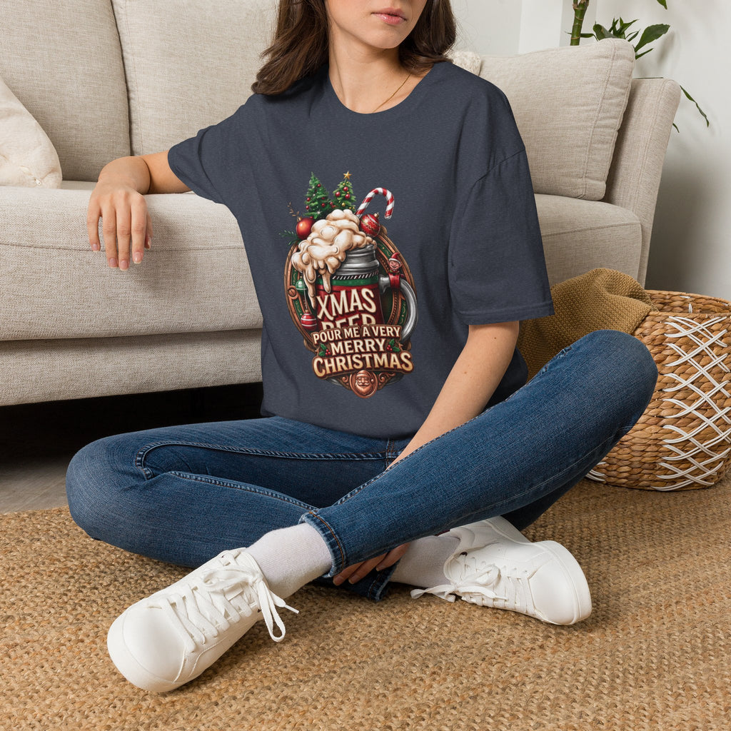 XMAS Beer Pour Me a Very Merry Christmas t-shirt in Heather Navy, worn by a woman seated on a rug