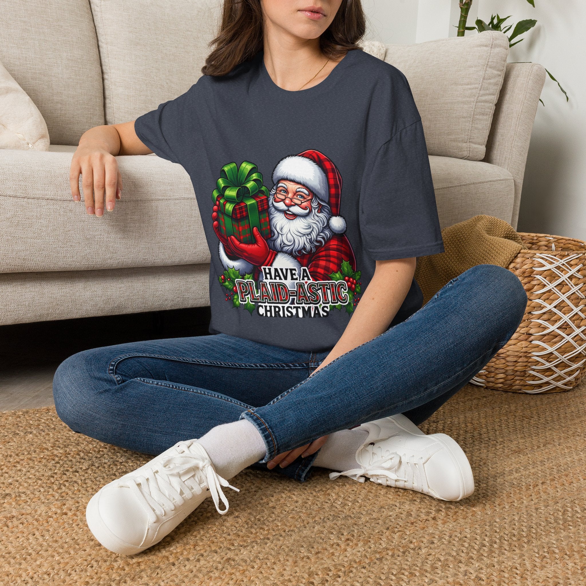 Santa Have a Plaid-astic t-shirt in Heather Navy, worn by a woman seated on a rug