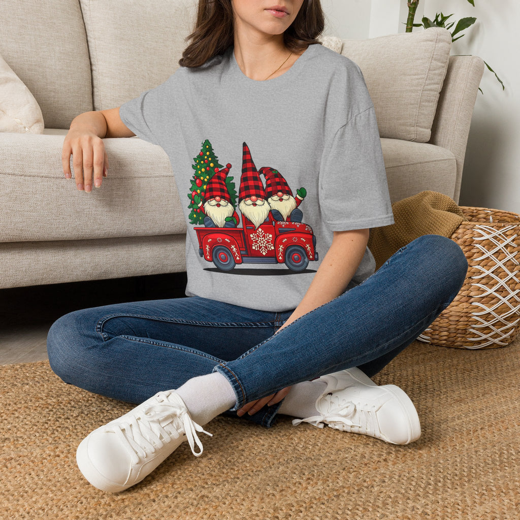 Buffalo Plaid Gnomes Red Truck t-shirt in Sport Grey, worn by a woman seated on a rug