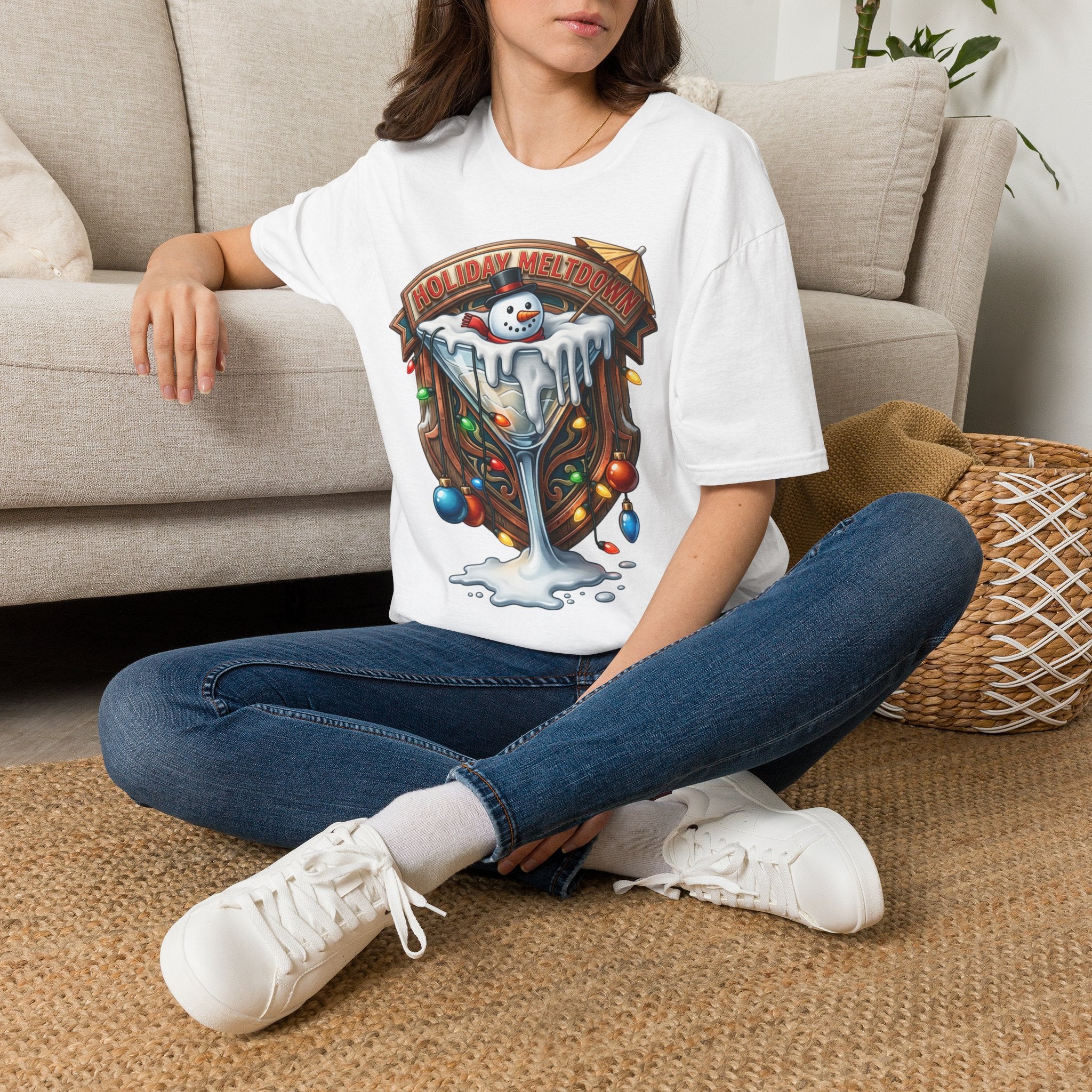 Holiday Meltdown Snowman Martini t-shirt in White, worn by a woman seated on a rug
