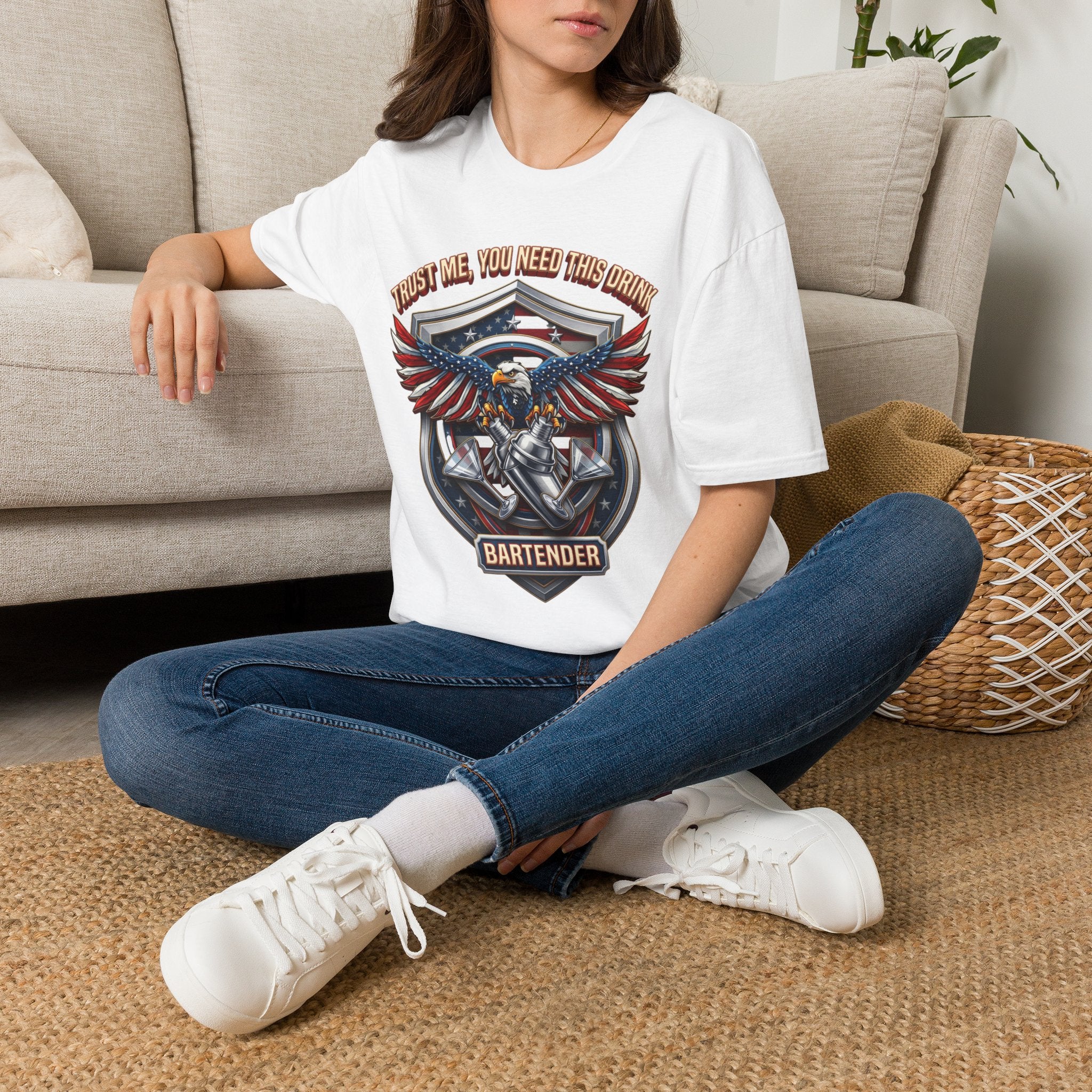 Bartender Eagle Trust Me You Need This Drink t-shirt in White, worn by a woman seated on a rug