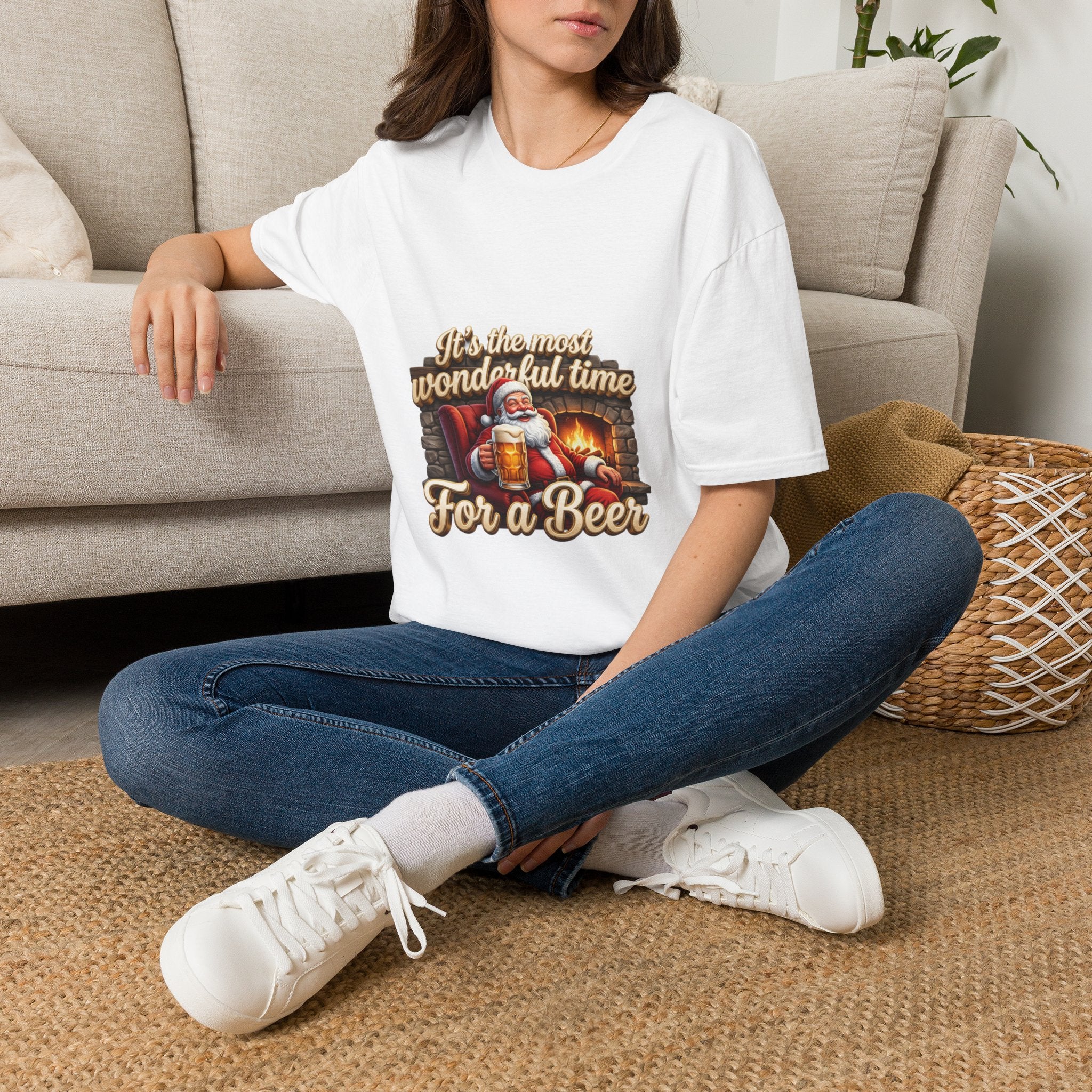 Most Wonderful Time for a Beer Santa t-shirt in White, worn by a woman seated on a rug