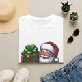 Santa Have a Plaid-astic print on a White t-shirt, folded beside a straw hat and jeans