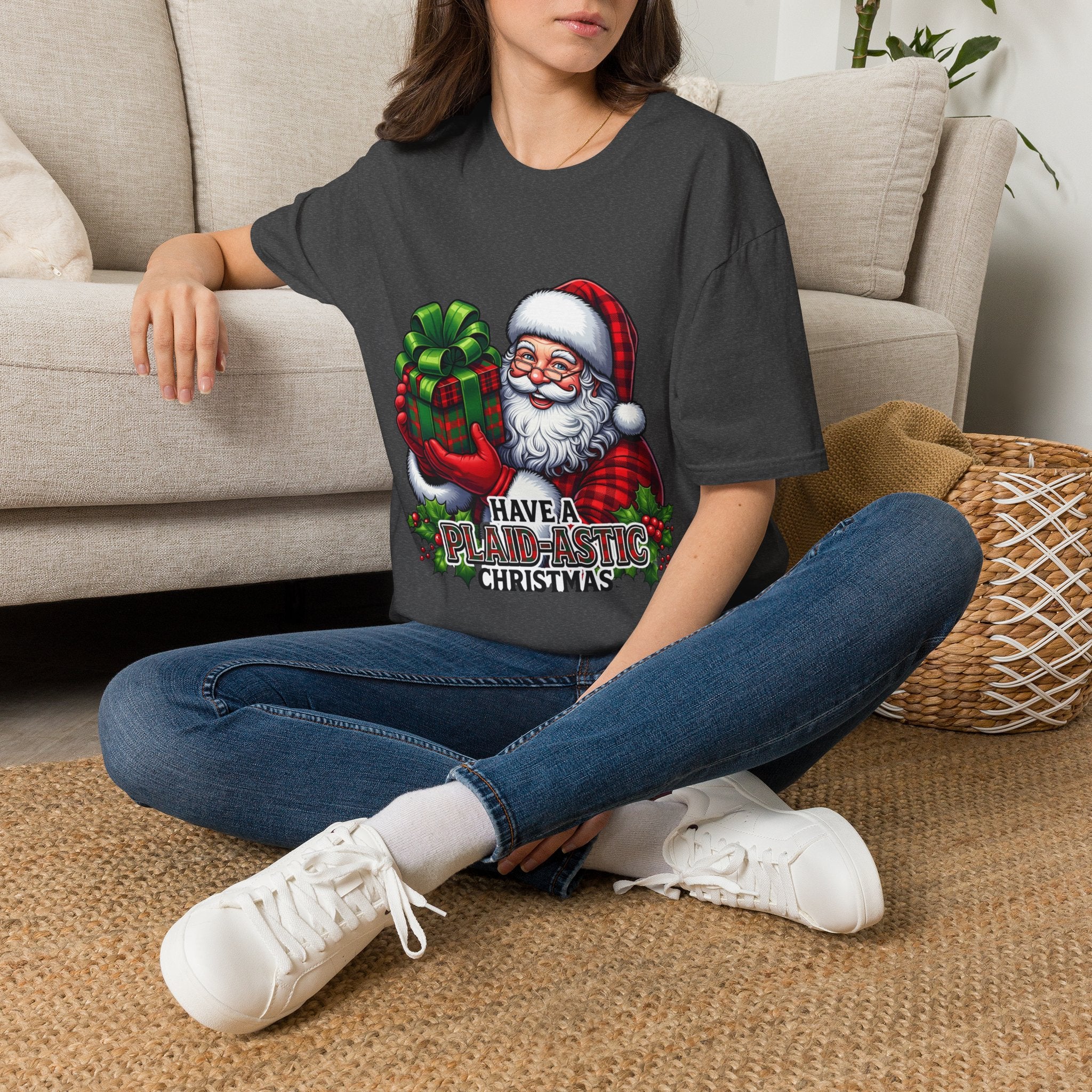 Santa Have a Plaid-astic t-shirt in Dark Heather, worn by a woman seated on a rug