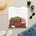 Dear Santa Just Bring Beer Funny print on a White t-shirt, folded beside a straw hat and jeans