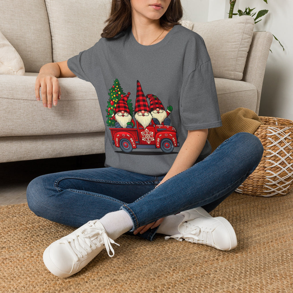 Buffalo Plaid Gnomes Red Truck t-shirt in Graphite Heather, worn by a woman seated on a rug