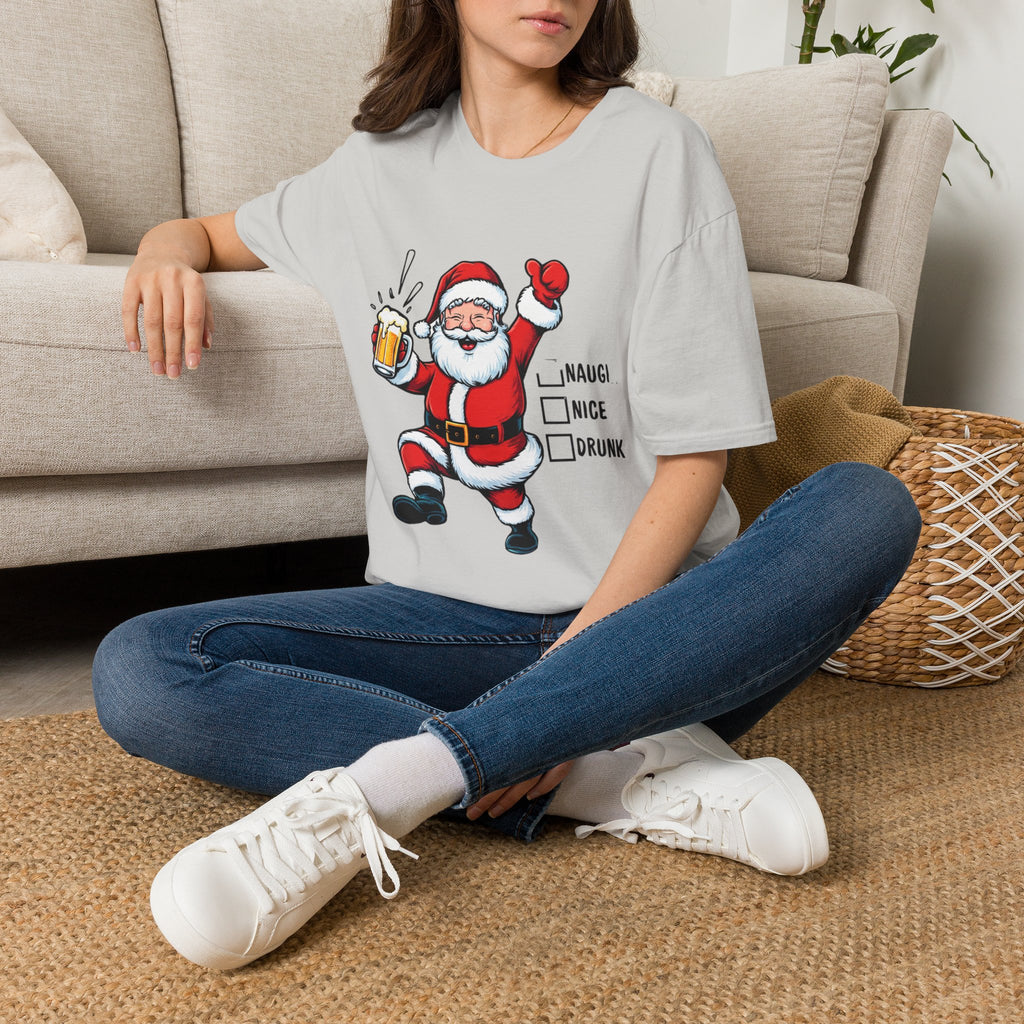 Naughty Nice Drunk Santa Beer Checklist t-shirt in Ice Grey, worn by a woman seated on a rug