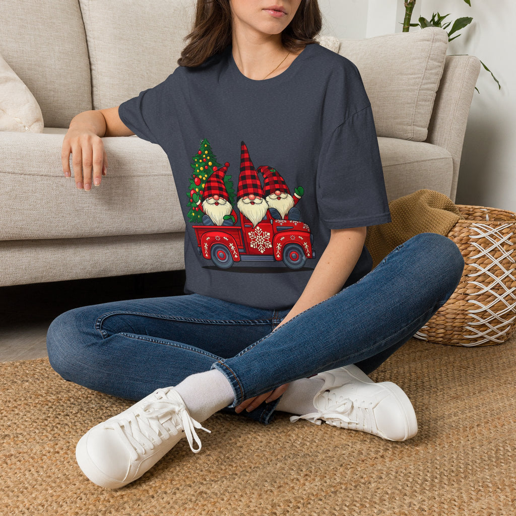 Buffalo Plaid Gnomes Red Truck t-shirt in Heather Navy, worn by a woman seated on a rug