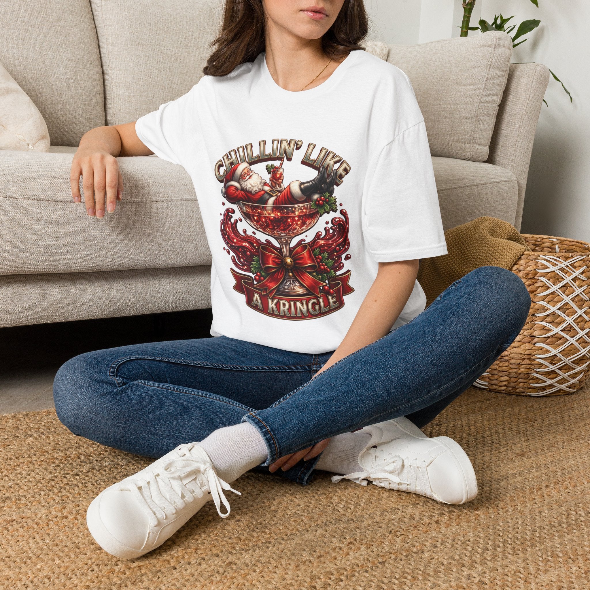 Chillin' Like a Kringle Santa t-shirt in White, worn by a woman seated on a rug