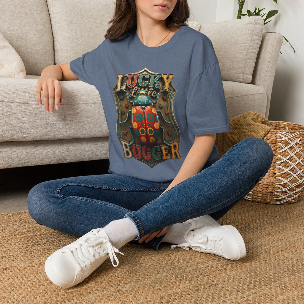 Lucky Little Bugger Vintage Beetle t-shirt in Heather Indigo, worn by a woman seated on a rug