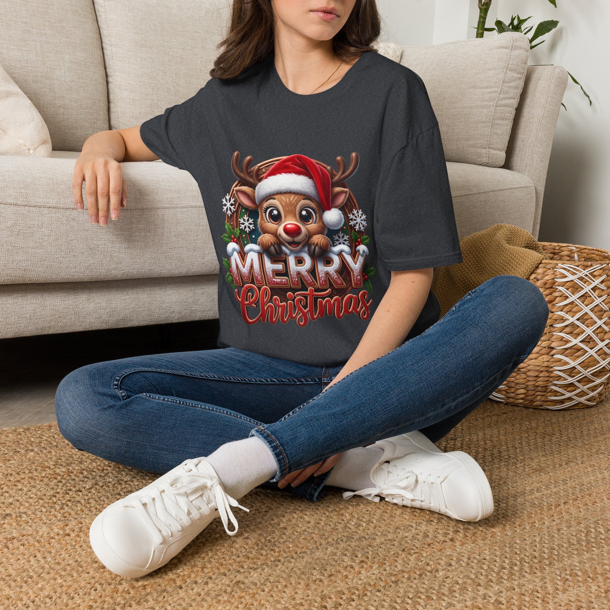 Cute Red-Nosed Reindeer t-shirt in Dark Heather Grey, worn by a woman seated on a rug