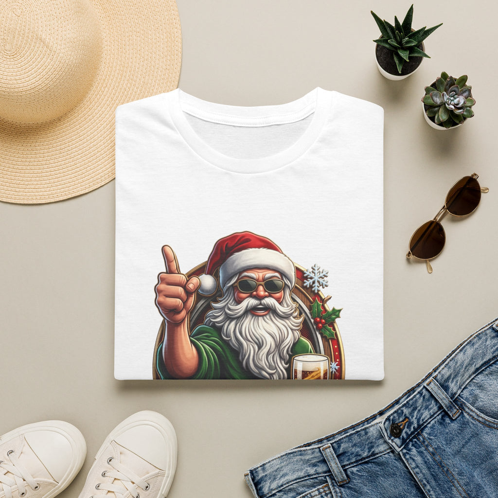 Cheers to the Naughty List Santa Beer print on a White t-shirt, folded beside a straw hat and jeans