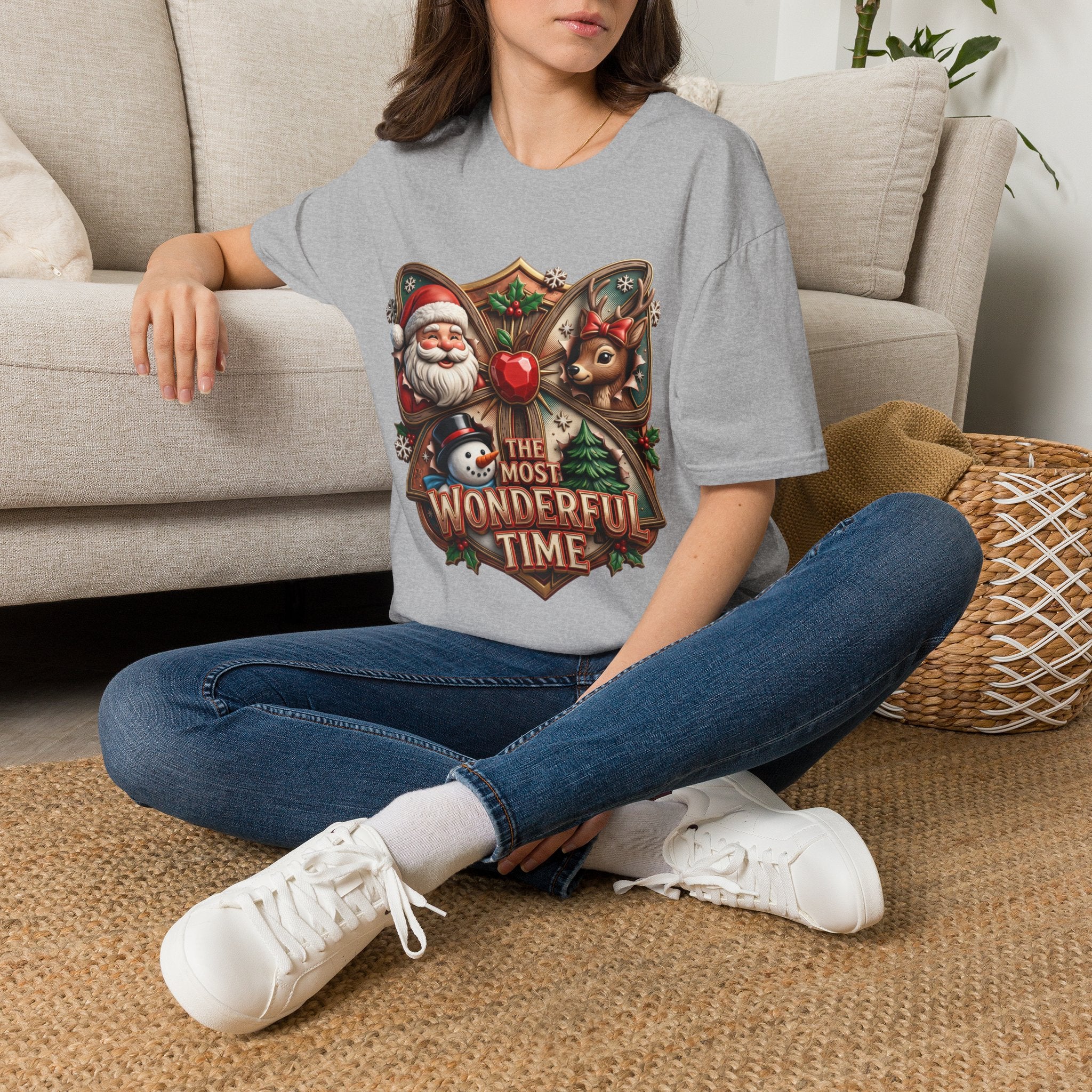 The Most Wonderful Time Wood Crest Santa t-shirt in Sport Grey, worn by a woman seated on a rug