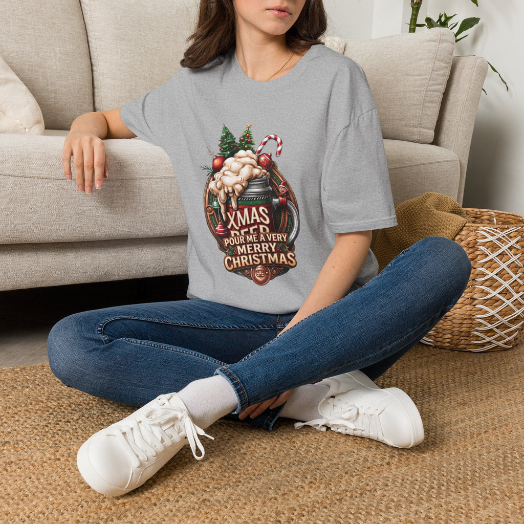 XMAS Beer Pour Me a Very Merry Christmas t-shirt in Sport Grey, worn by a woman seated on a rug