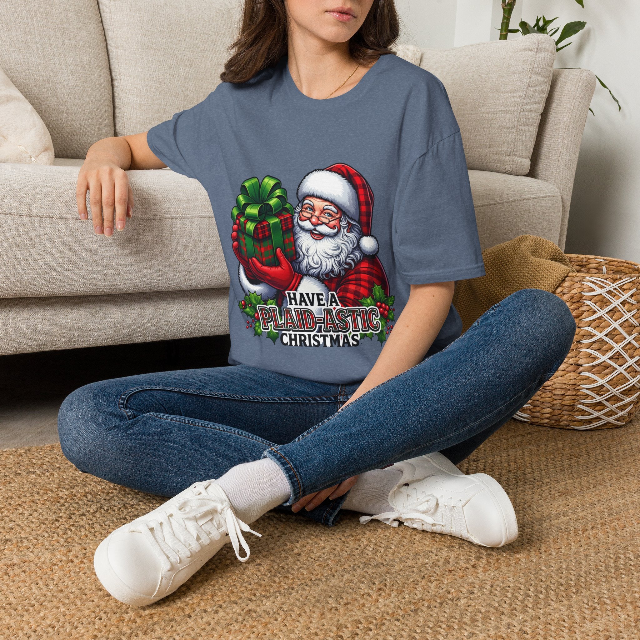 Santa Have a Plaid-astic t-shirt in Heather Indigo, worn by a woman seated on a rug