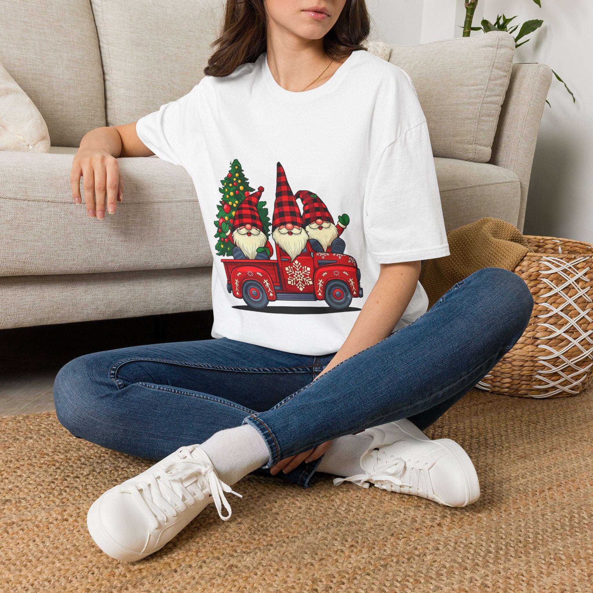 Buffalo Plaid Gnomes Red Truck t-shirt in White, worn by a woman seated on a rug