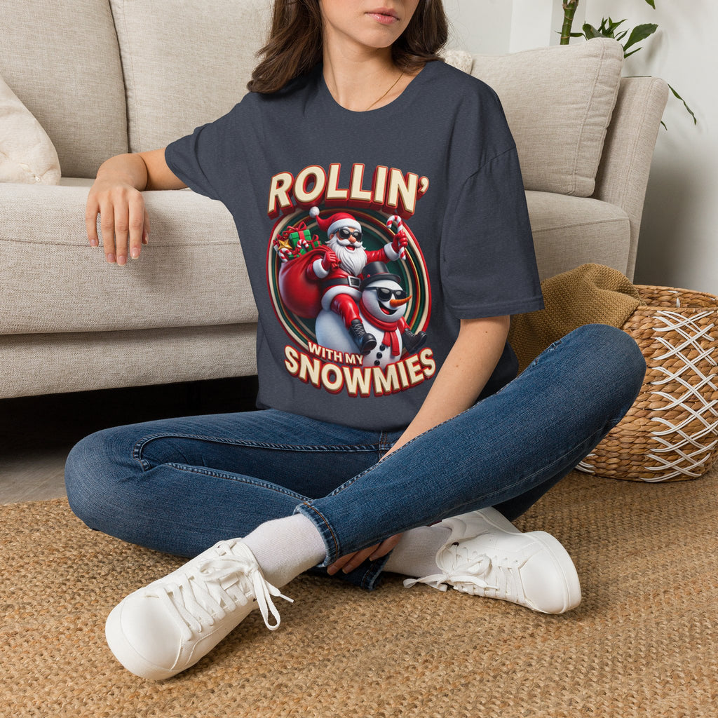 Rollin' with My Snowmies Santa & Snowman t-shirt in Heather Navy, worn by a woman seated on a rug