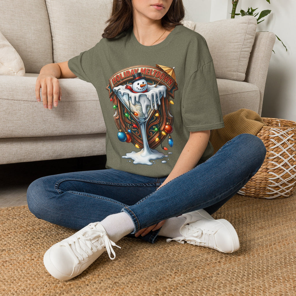 Holiday Meltdown Snowman Martini t-shirt in Heather Military Green, worn by a woman seated on a rug