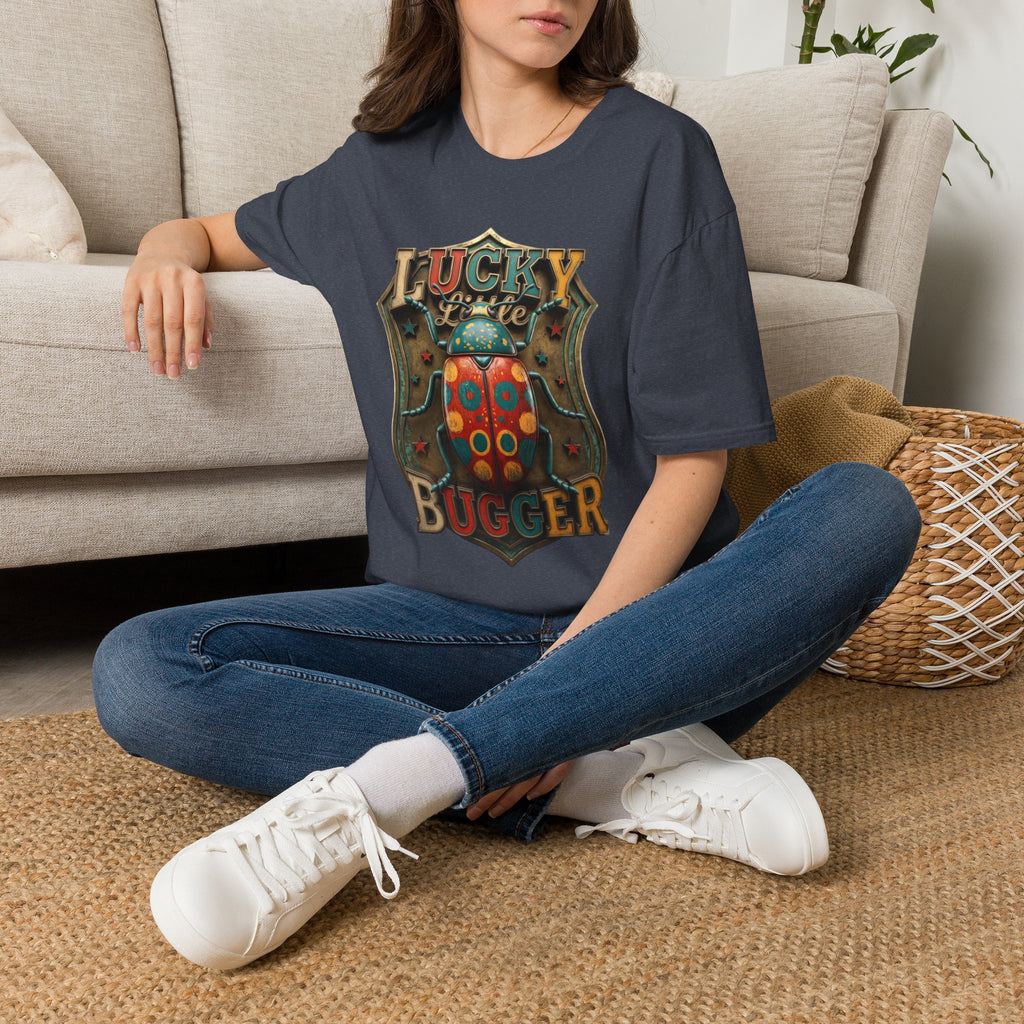 Lucky Little Bugger Vintage Beetle t-shirt in Heather Navy, worn by a woman seated on a rug