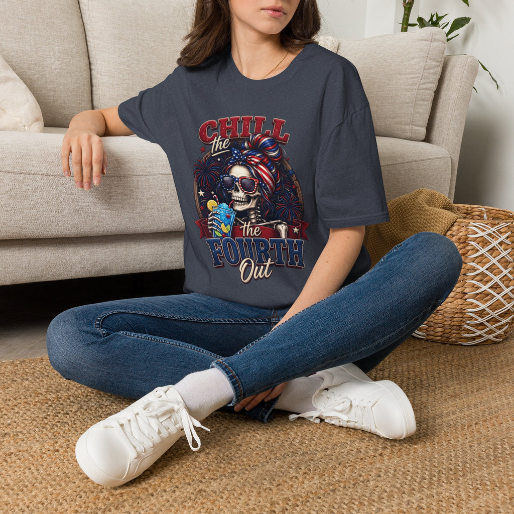 Chill the Fourth Out Patriotic Skeleton 4th of July t-shirt in Heather Navy, worn by a woman seated on a rug