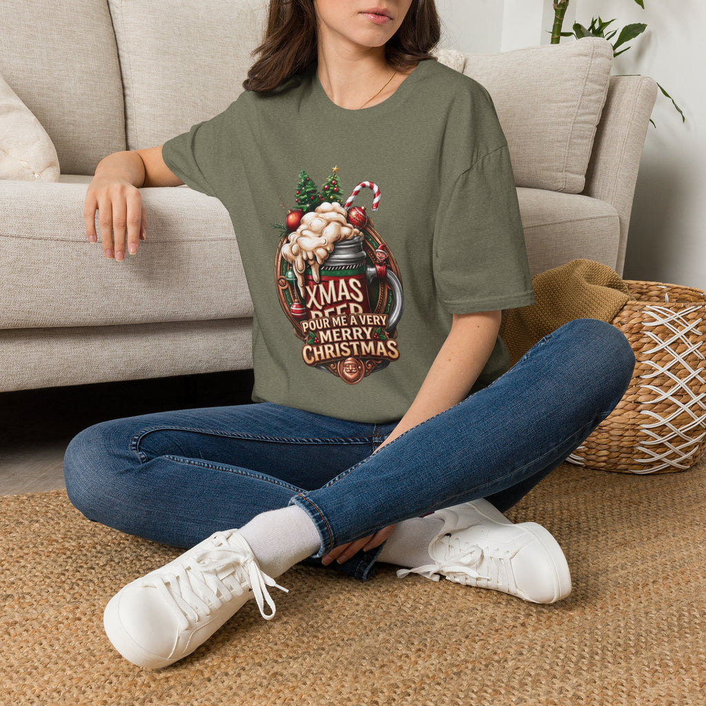 XMAS Beer Pour Me a Very Merry Christmas t-shirt in Heather Military Green, worn by a woman seated on a rug
