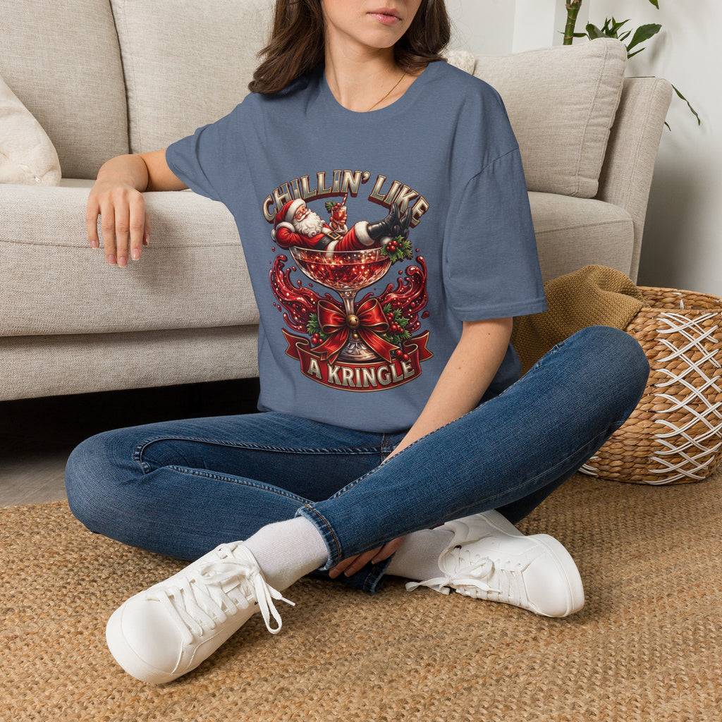 Chillin' Like a Kringle Santa t-shirt in Heather Indigo, worn by a woman seated on a rug