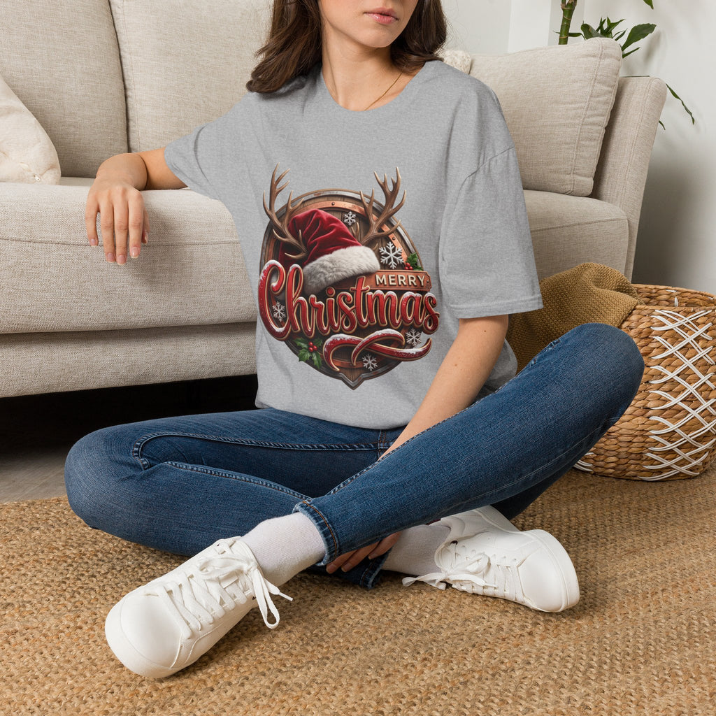 Merry Christmas Vintage Santa Hat & Antlers t-shirt in Sport Grey, worn by a woman seated on a rug