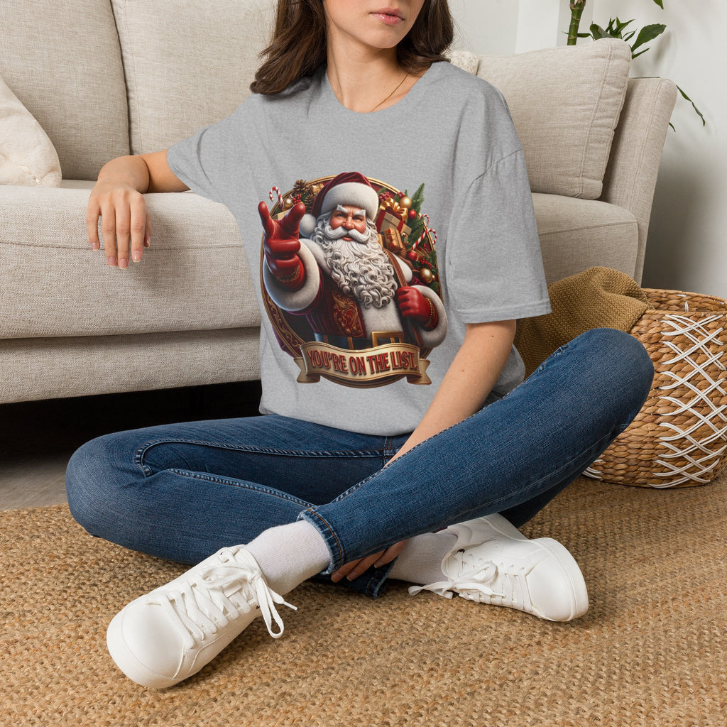 Santa You're On The List Pointing t-shirt in Sport Grey, worn by a woman seated on a rug