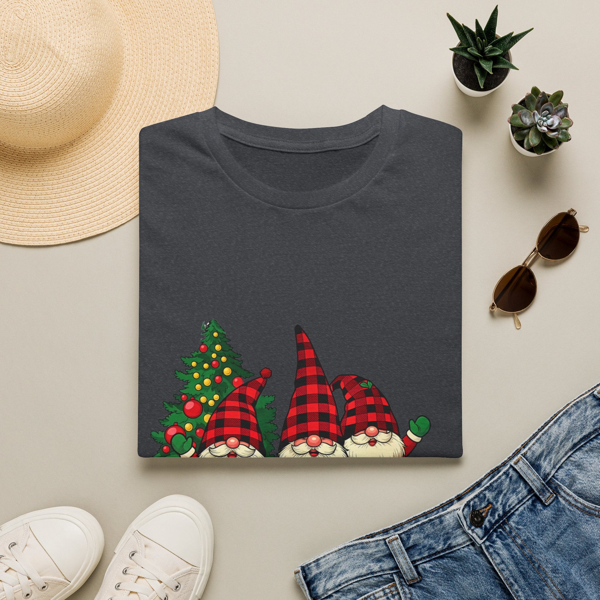 Buffalo Plaid Gnomes Red Truck print on a Dark Heather Grey t-shirt, folded beside a straw hat and jeans