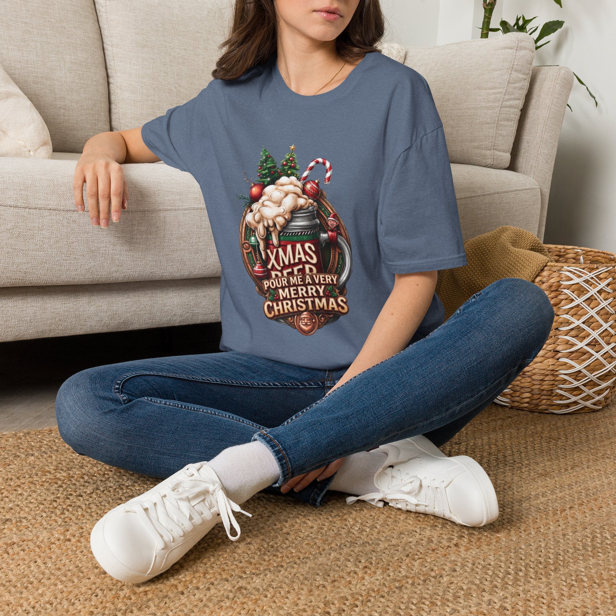 XMAS Beer Pour Me a Very Merry Christmas t-shirt in Heather Indigo, worn by a woman seated on a rug