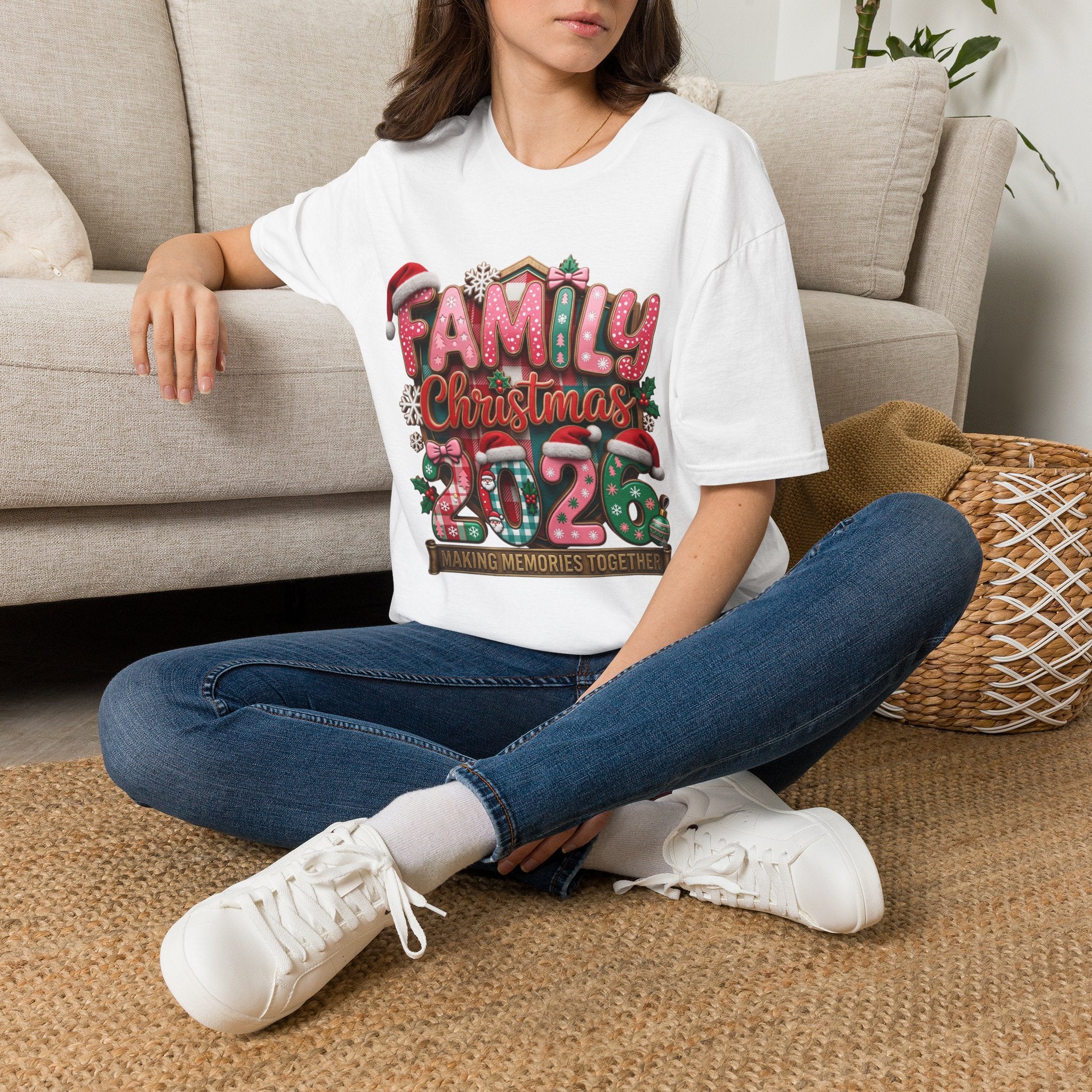Family Christmas 2026 Making Memories Together t-shirt in White, worn by a woman seated on a rug